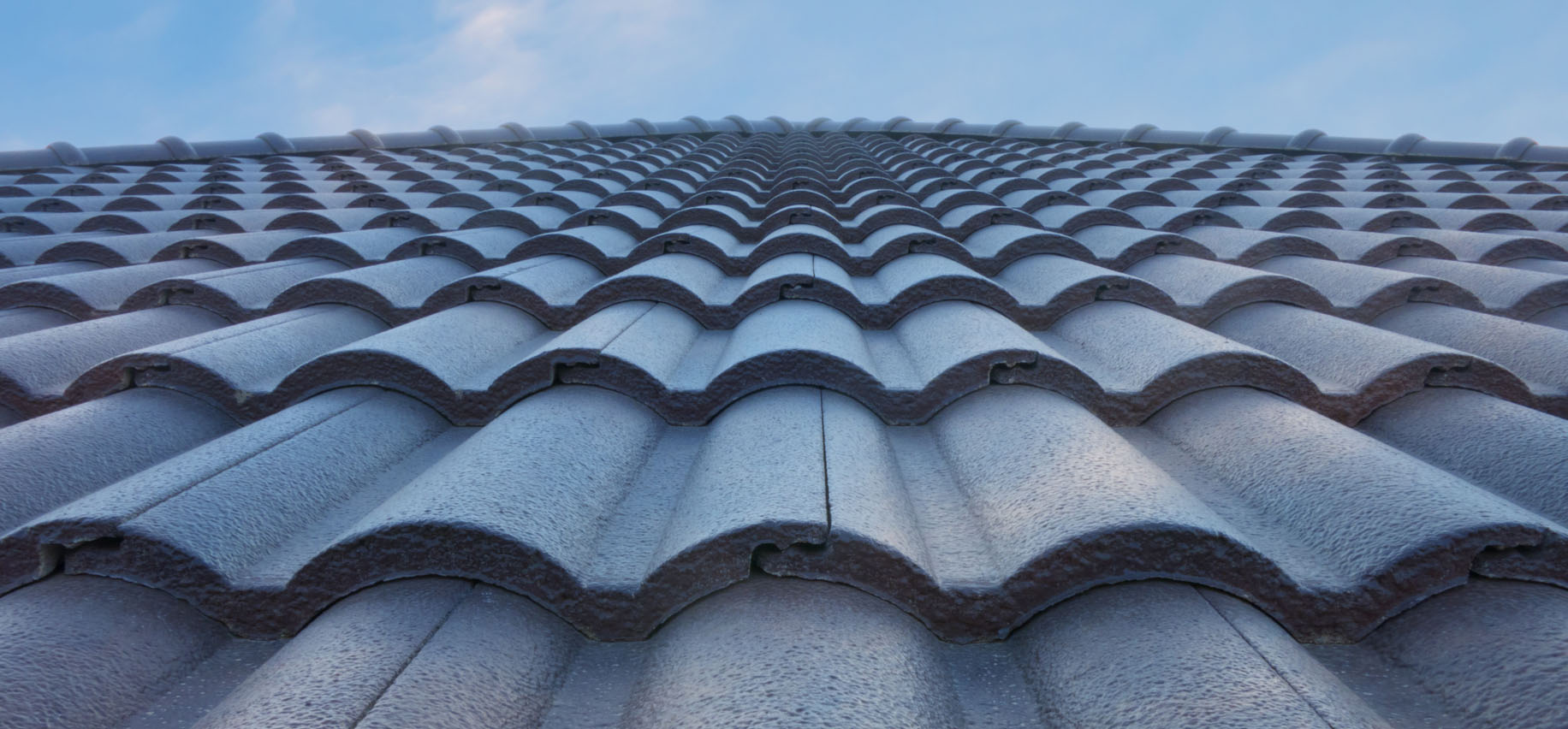 workers on a roof image